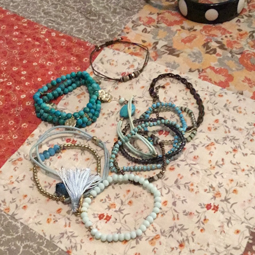 Lot of 12 beaded/ stretchy bracelets.